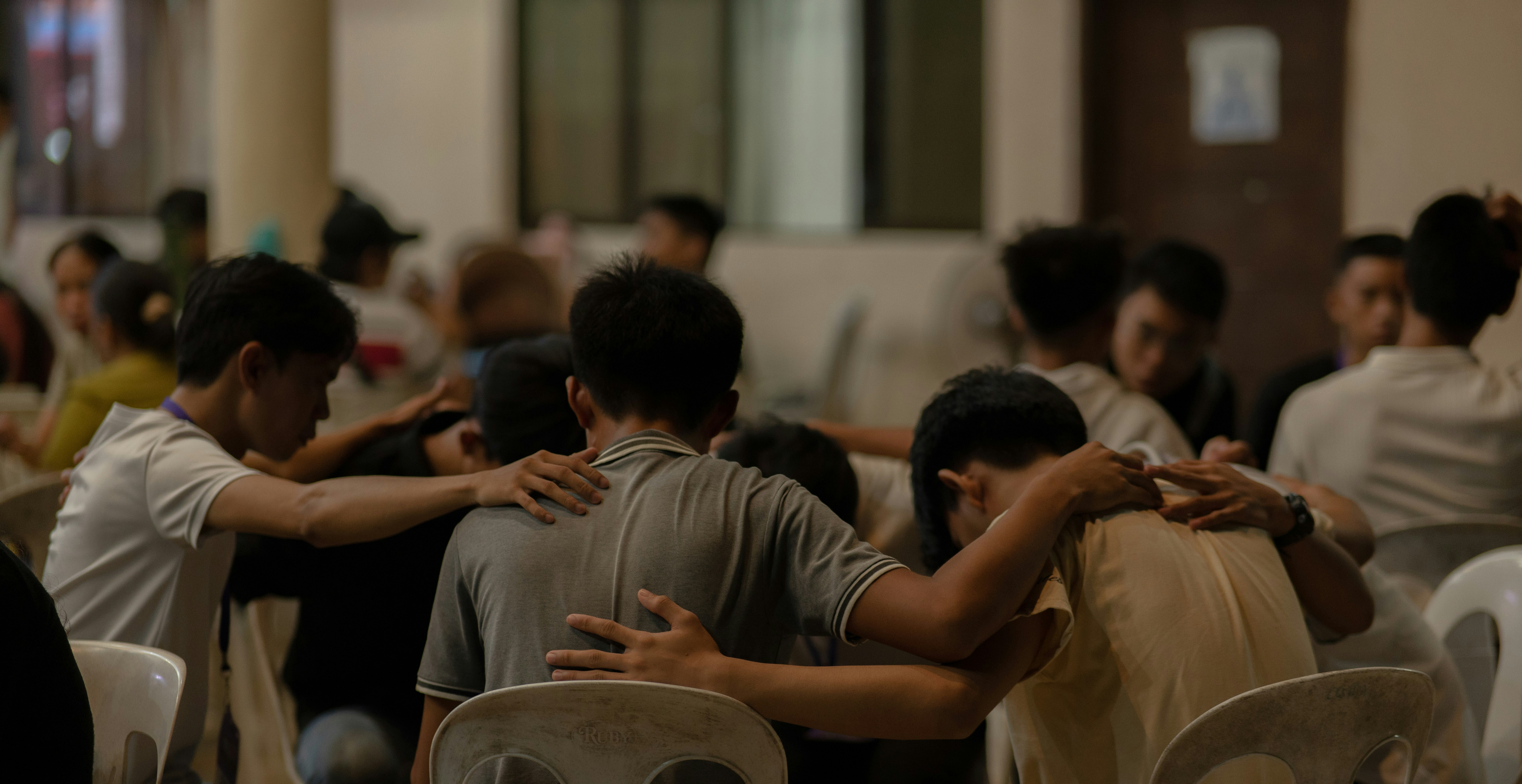 Young men in prayer